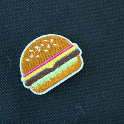 Hamburger patch on a dark fabric background