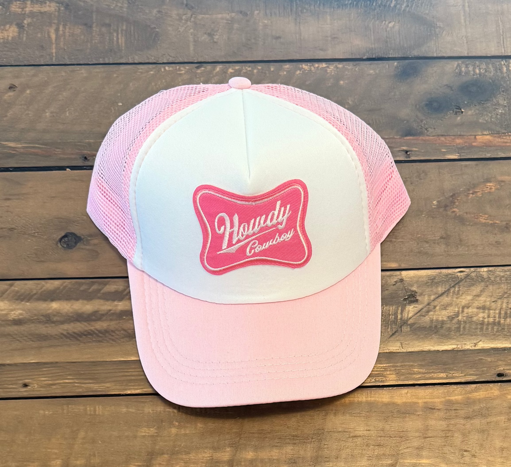 Pink and white hat with a Hot pink "Howdy Cowboy" patch